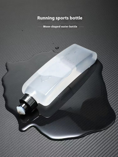 Moon-shaped water bottle on a textured gray background