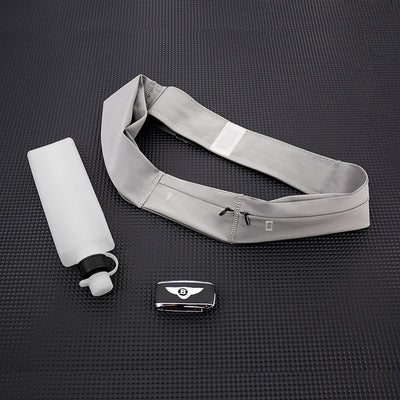 Gray waist bag with a water bottle and phone on a black textured surface